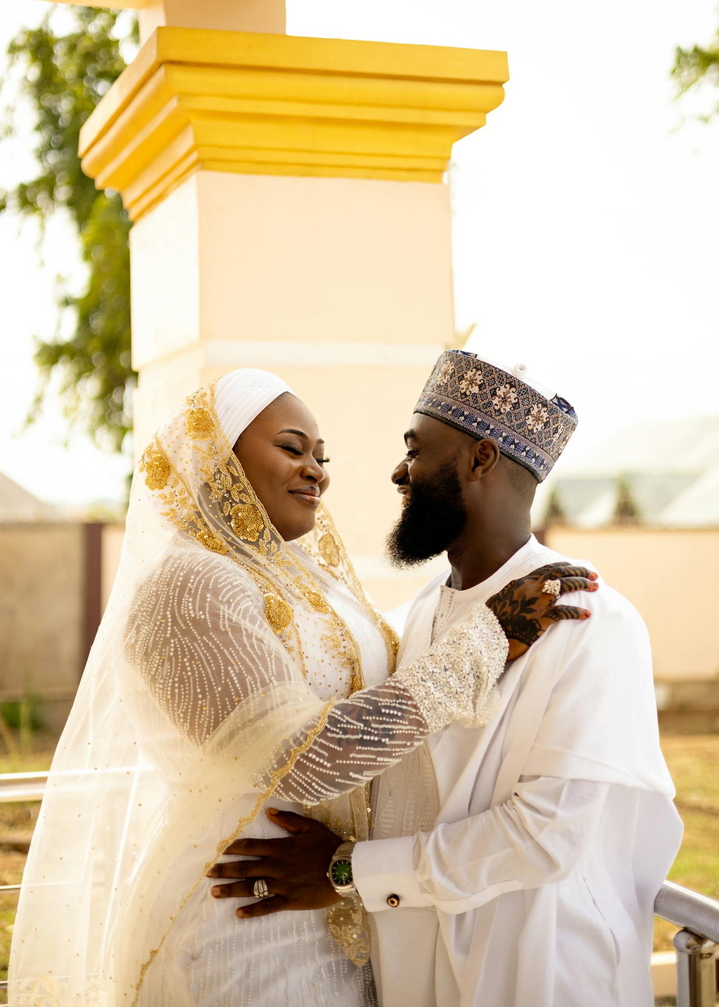 Elegant moment of a couple's wedding wearing traditional attire.