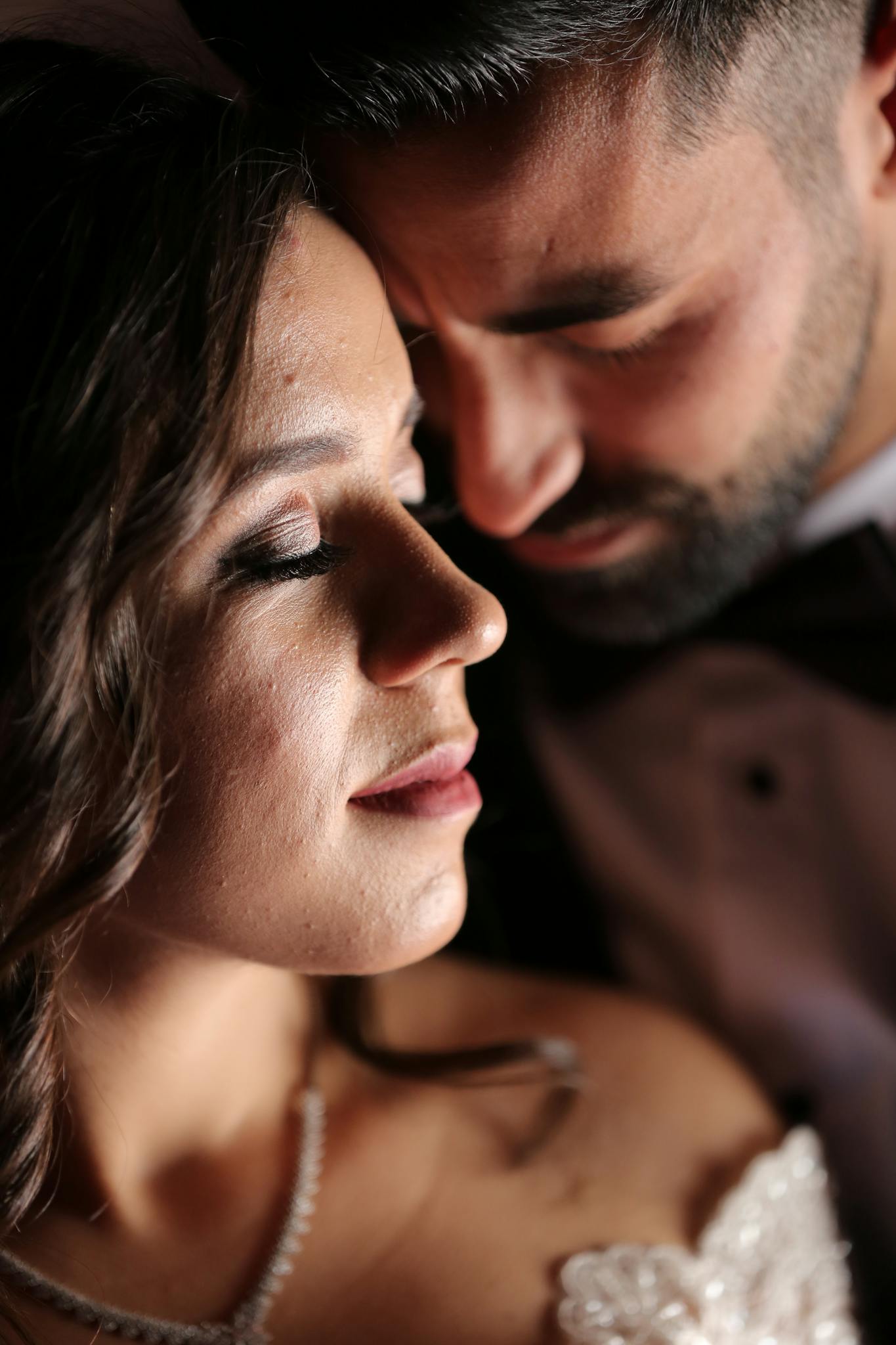 Intimate portrait capturing the love between bride and groom on their wedding day.